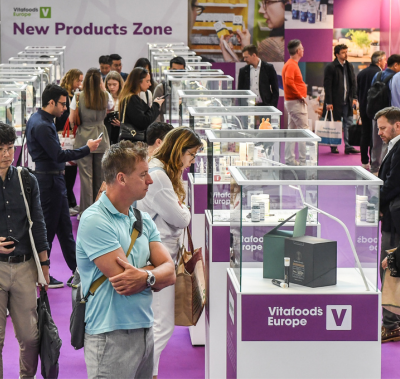 visitors listening to an exhibitor talking